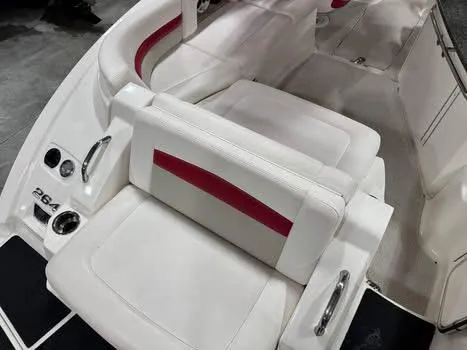 Slide: The Image of 2009 Chaparral 264 Sunesta boat interior with white and red seating. - 10