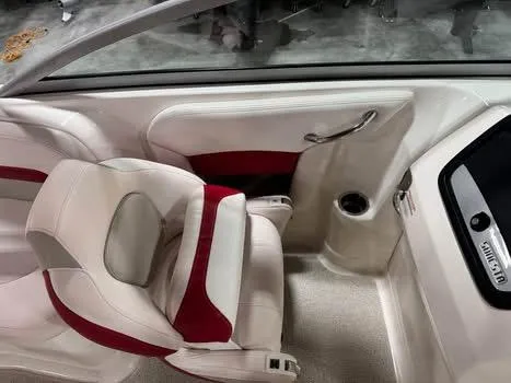 Slide: The Image of 2009 Chaparral 264 Sunesta boat interior with white and red seating. - 13
