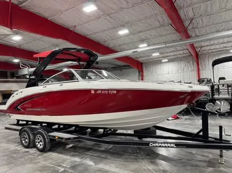 Slide: The Image of 2009 Chaparral 264 Sunesta boat on trailer in indoor storage facility. - 2