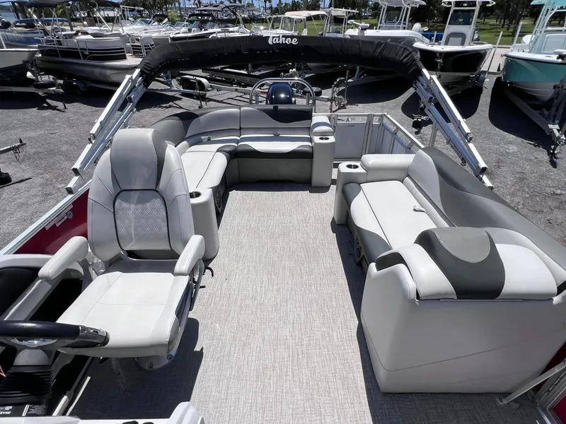 Slide: The Image of 2022 Tahoe Pontoon LTZ 2485 EL interior with spacious seating and modern design. - 18