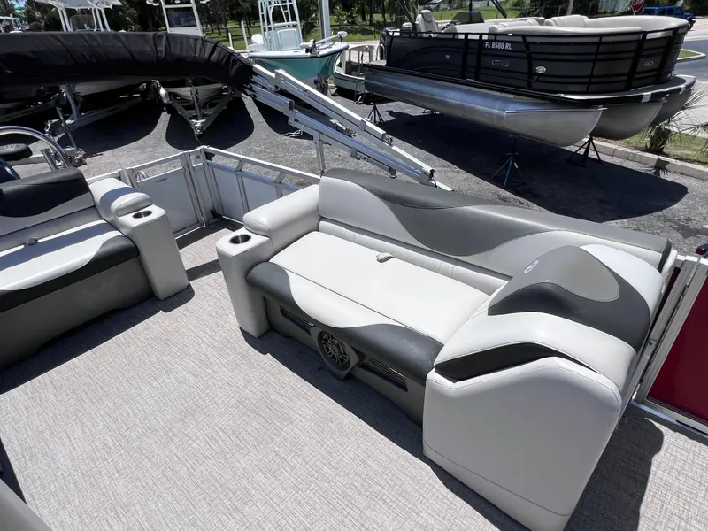 Slide: The Image of 2022 Tahoe Pontoon LTZ 2485 EL interior with plush seating and modern design. - 19