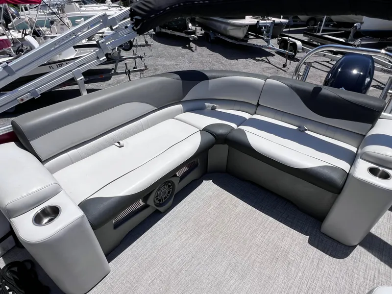 Slide: The Image of Luxurious seating on 2022 Tahoe Pontoon LTZ 2485 EL boat, featuring cup holders and sleek design. - 20
