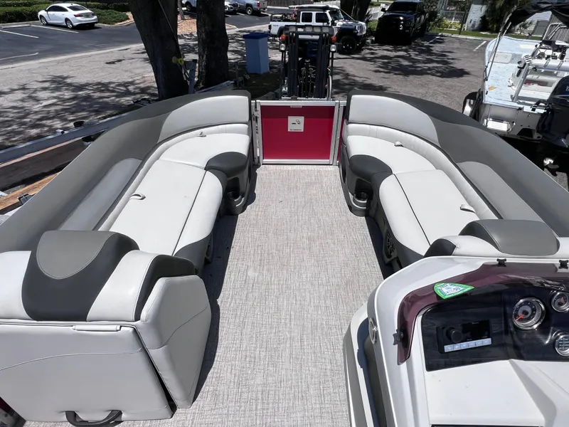 Slide: The Image of 2022 Tahoe Pontoon LTZ 2485 EL interior with spacious seating and modern dashboard. - 22