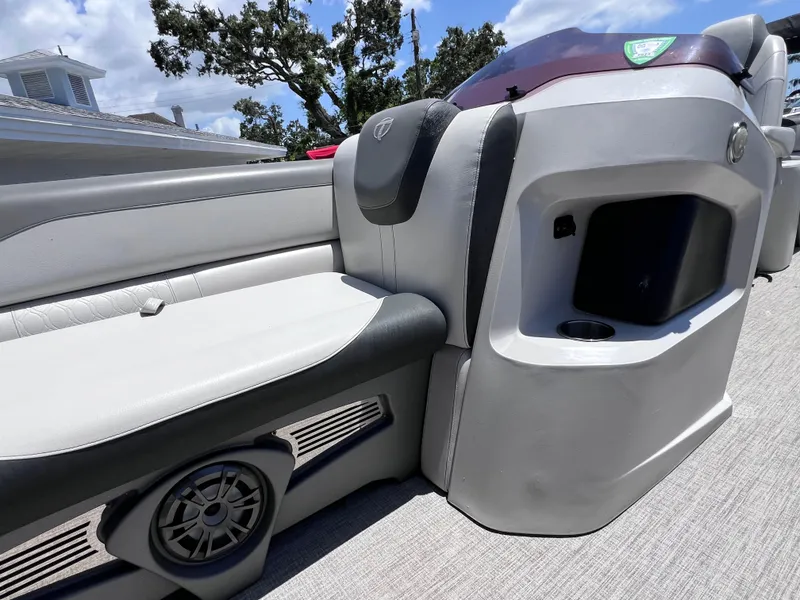 Slide: The Image of 2022 Tahoe Pontoon LTZ 2485 EL interior with seating and speaker detail. - 25