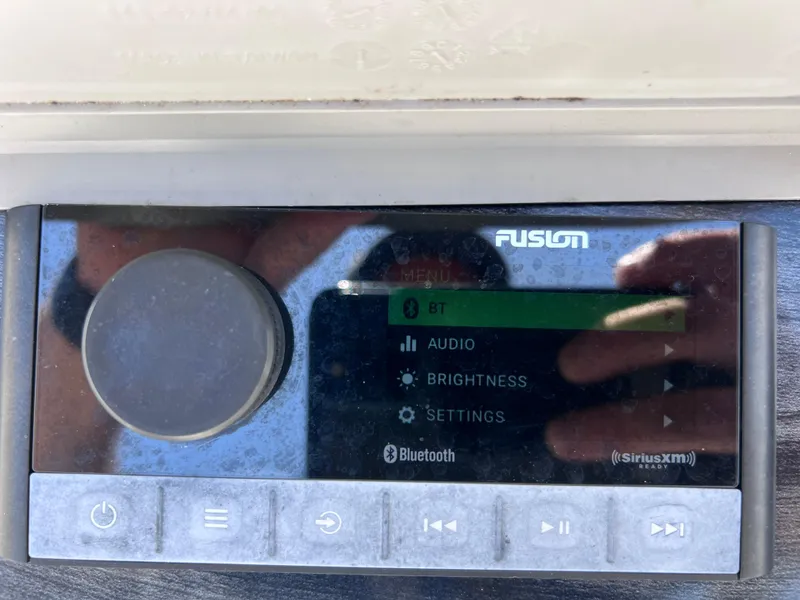 Slide: The Image of Fusion audio system display on 2022 Tahoe Pontoon LTZ 2485 EL boat. - 31