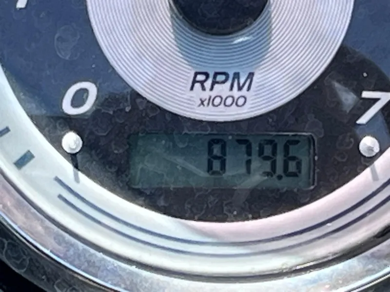 Slide: The Image of Close-up of a 2022 Tahoe Pontoon LTZ 2485 EL RPM gauge displaying 879.6. - 33
