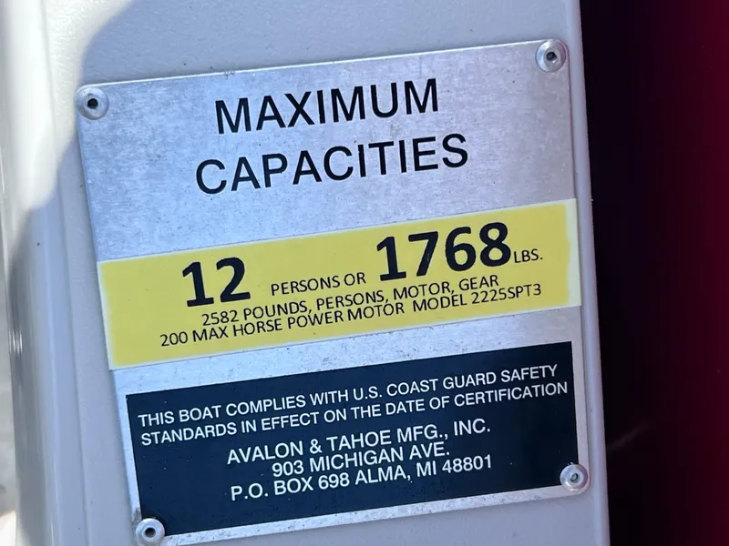 Slide: The Image of Capacity plate on 2022 Tahoe Pontoon LTZ 2485 EL, max 12 persons or 1768 lbs. - 35
