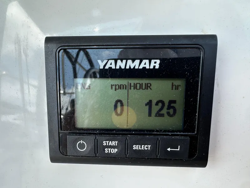 Slide: The Image of Yanmar engine display showing 125 hours on Jeanneau Sun Odyssey 410, 2024 model. - 25