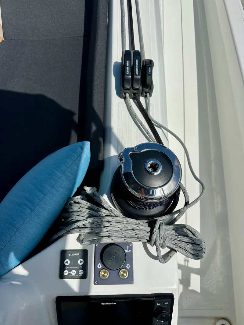 Slide: The Image of Jeanneau Sun Odyssey 410 deck with winch, ropes, and control panel, 2024 model. - 27