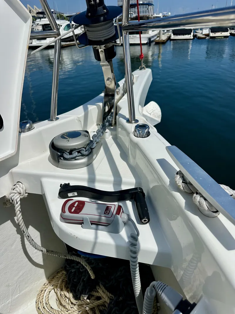 Slide: The Image of 2024 Jeanneau Sun Odyssey 410 yacht deck with anchor chain and control panel. - 31