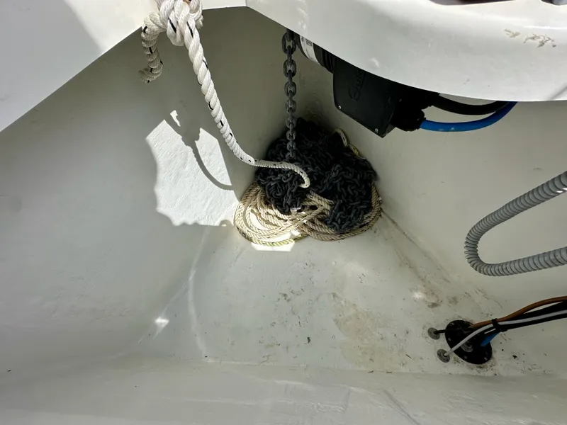 Slide: The Image of Anchor locker of 2024 Jeanneau Sun Odyssey 410 with rope and chain. - 32