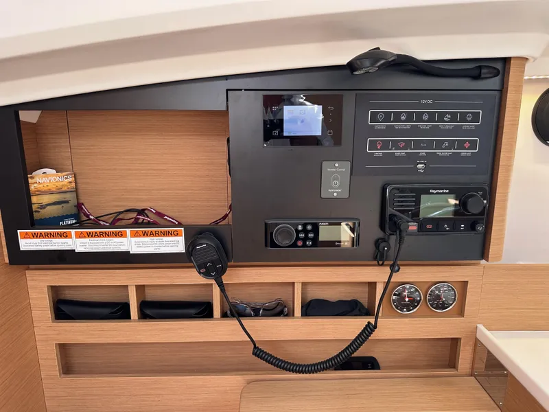Slide: The Image of Control panel of 2024 Jeanneau Sun Odyssey 410 sailboat with navigation and communication equipment. - 48