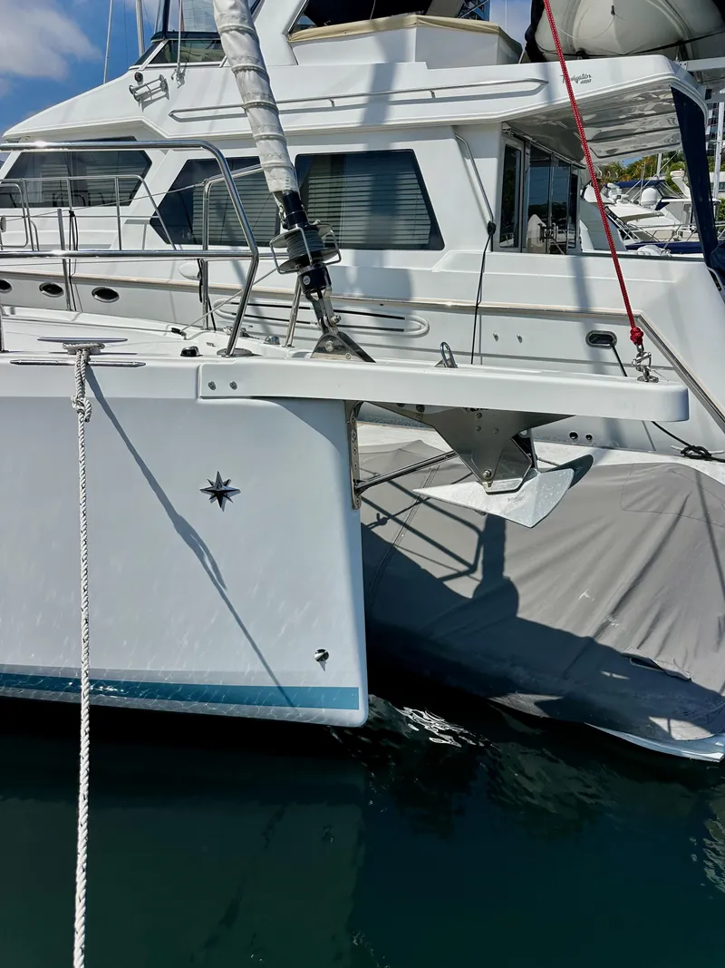Slide: The Image of 2024 Jeanneau Sun Odyssey 410 sailboat docked in marina, side view. - 5