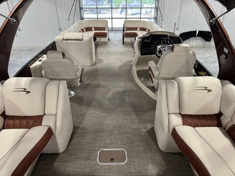 Slide: The Image of Luxurious interior of 2022 Bennington QX 30 pontoon boat with plush seating and modern design. - 7