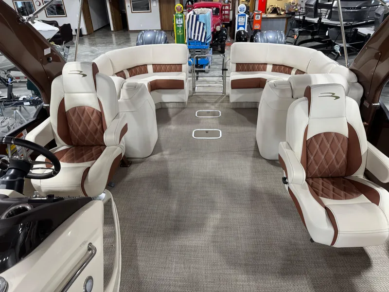 Slide: The Image of 2022 Bennington QX 30 boat interior with luxurious seating and modern design. - 9