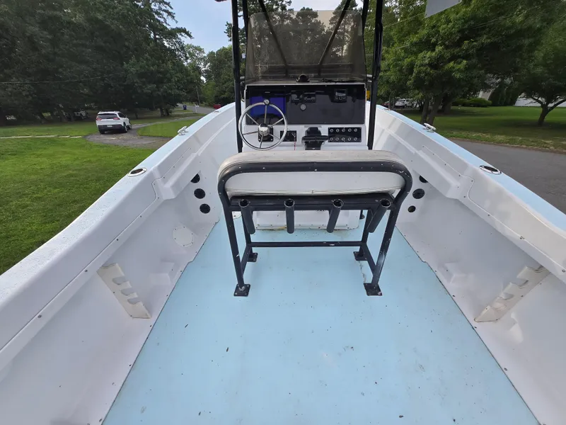 Slide: The Image of 1994 Grady-White Chase 263 boat interior with steering console and seating. - 6