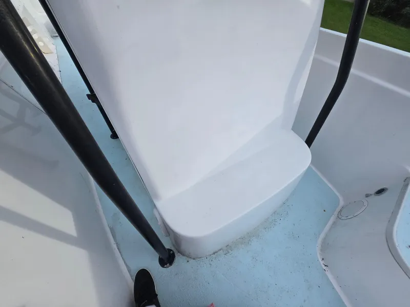 Slide: The Image of Interior view of a 1994 Grady-White Chase 263 boat, featuring seating and railing. - 9