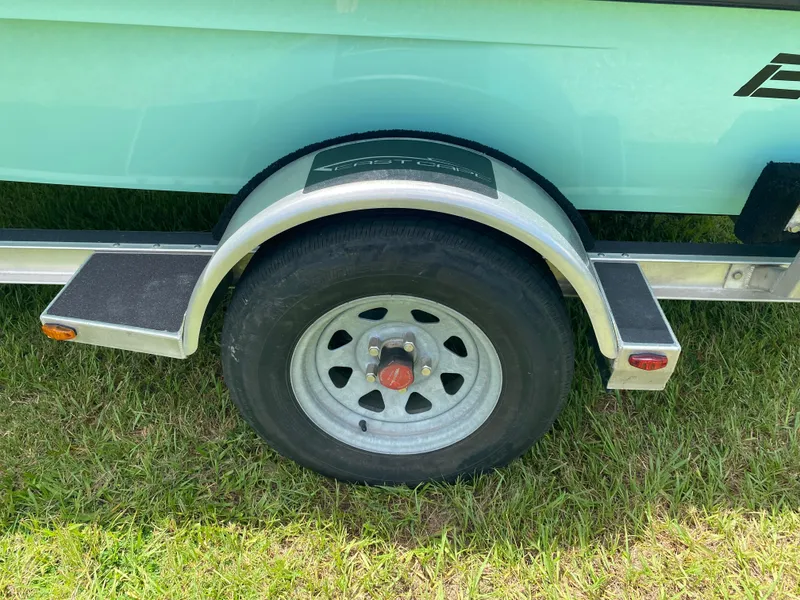Slide: The Image of Trailer wheel of 2020 East Cape 18 EVO on grass. - 12