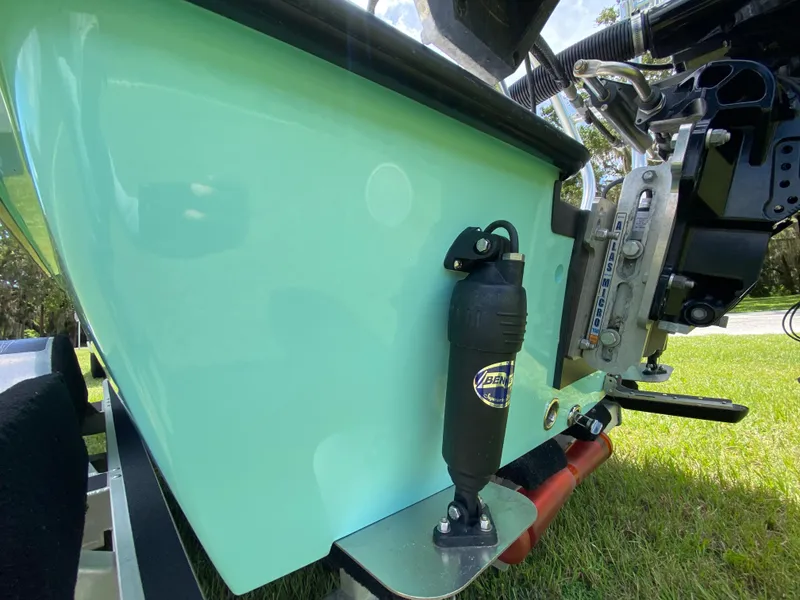 Slide: The Image of 2020 East Cape 18 EVO boat with hydraulic components, displayed on grass. - 15