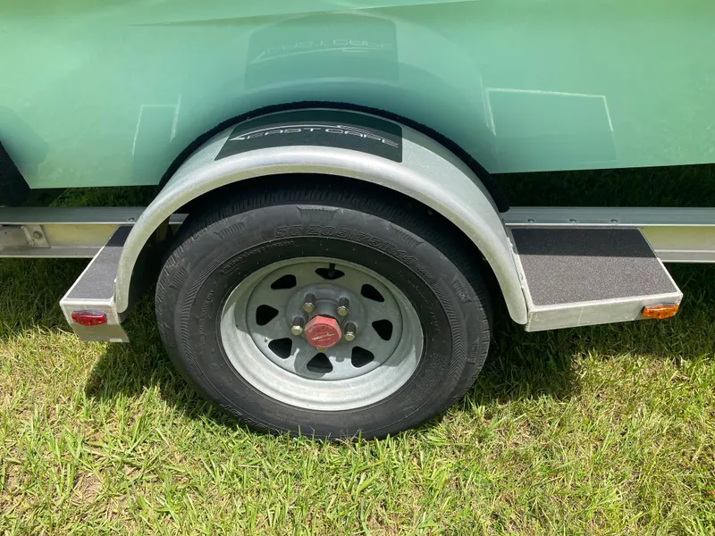 Slide: The Image of Trailer wheel of 2020 East Cape 18 EVO on grass. - 18