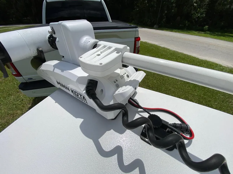 Slide: The Image of Minn Kota Terrova motor on 2020 East Cape 18 EVO boat, parked near a road. - 26