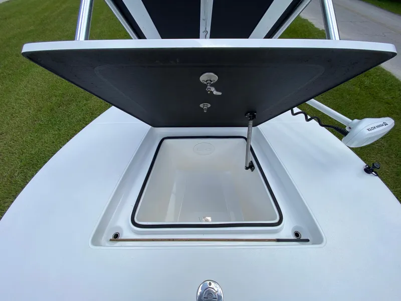 Slide: The Image of Open storage compartment on 2020 East Cape 18 EVO boat, showing interior details. - 29