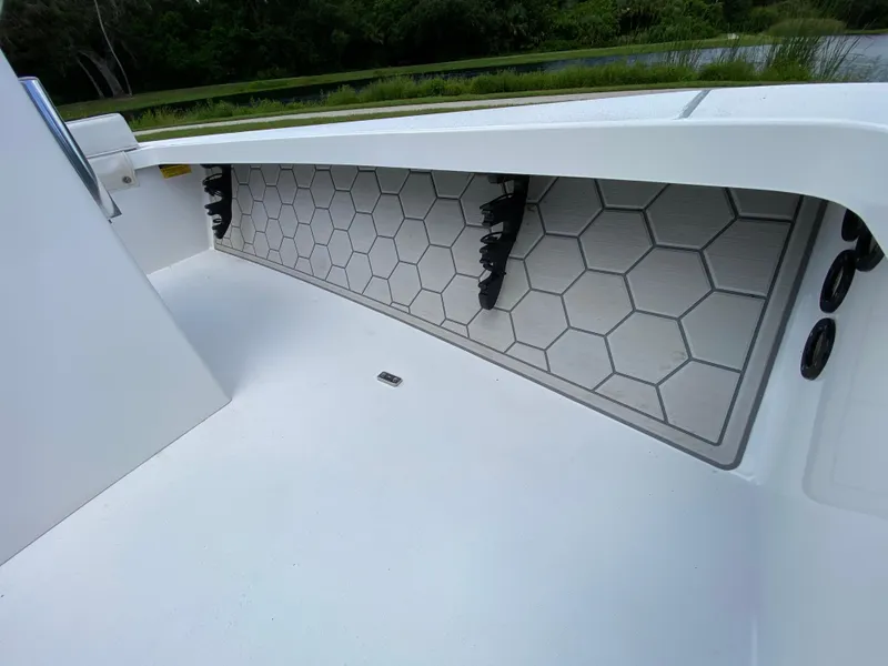 Slide: The Image of 2020 East Cape 18 EVO boat interior with hexagonal patterned flooring and rod holders. - 33