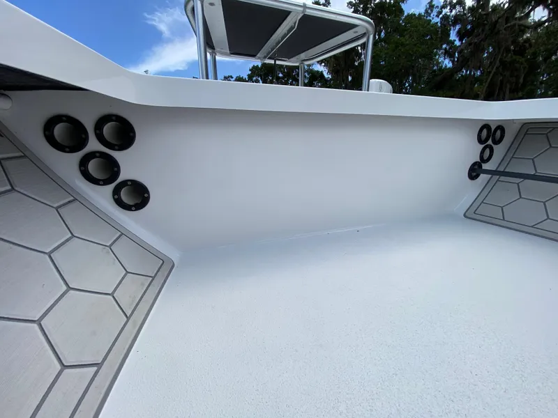 Slide: The Image of 2020 East Cape 18 EVO boat interior with hexagonal flooring and rod holders. - 34