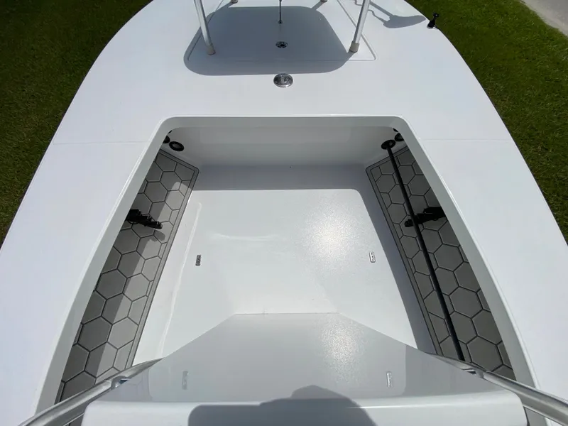Slide: The Image of 2020 East Cape 18 EVO boat interior with hexagonal patterned flooring. - 35
