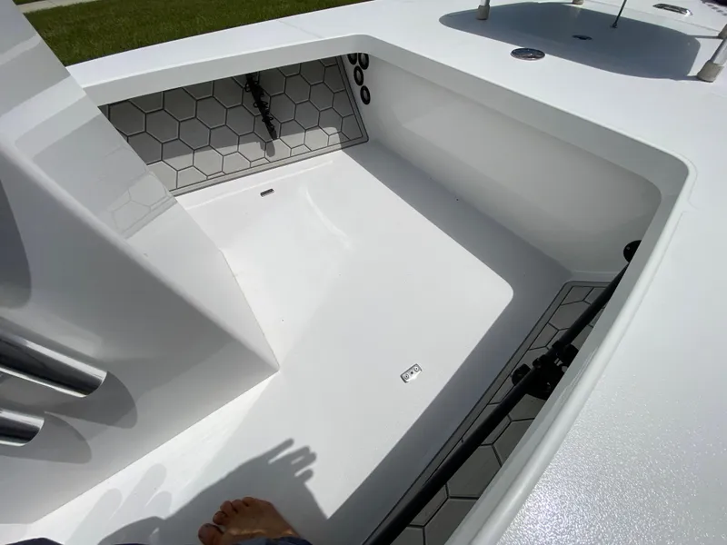 Slide: The Image of 2020 East Cape 18 EVO boat interior with hexagonal pattern and clean white finish. - 36