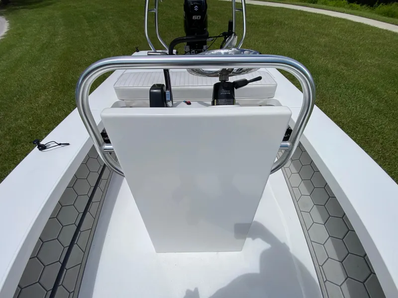 Slide: The Image of 2020 East Cape 18 EVO boat interior with hexagonal flooring and steering console. - 37