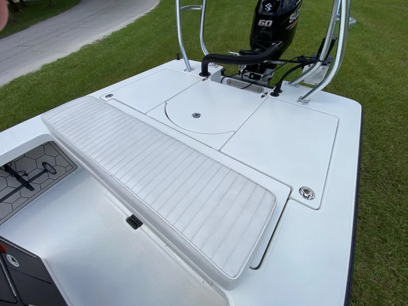 Slide: The Image of 2020 East Cape 18 EVO boat with Suzuki 60 engine, white deck, and cushioned seating. - 46