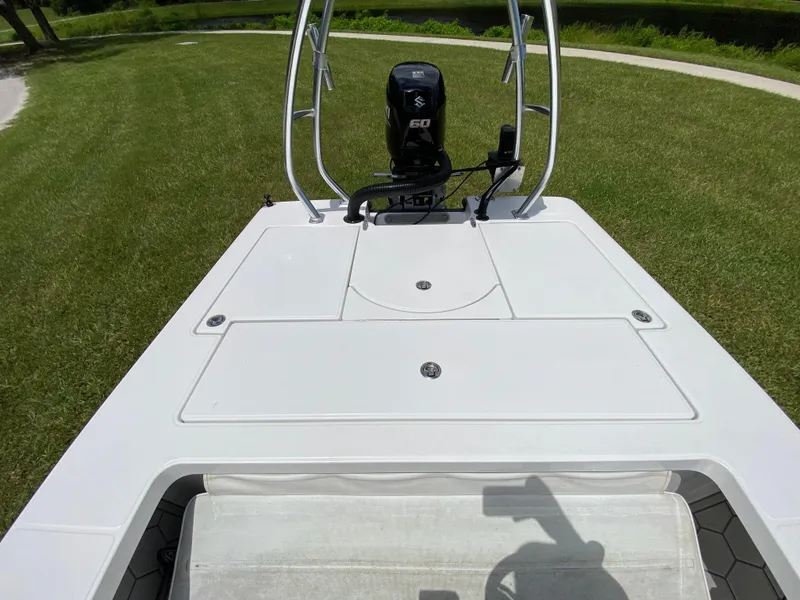 Slide: The Image of 2020 East Cape 18 EVO boat with Suzuki 60 engine on grassy area. - 47