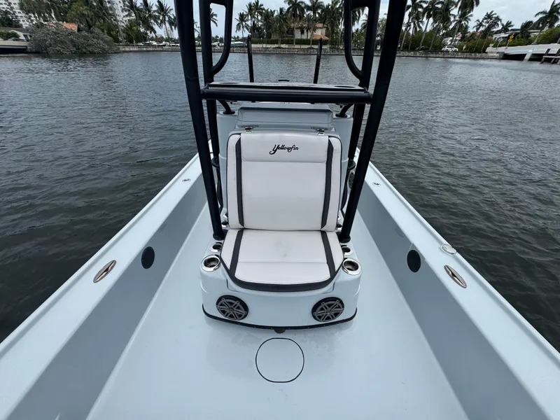 Slide: The Image of 2019 Yellowfin 24 Bay CE boat interior with seating and water view. - 20