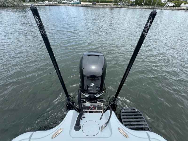 Slide: The Image of 2019 Yellowfin 24 Bay CE boat with dual Power-Pole anchors on water. - 33