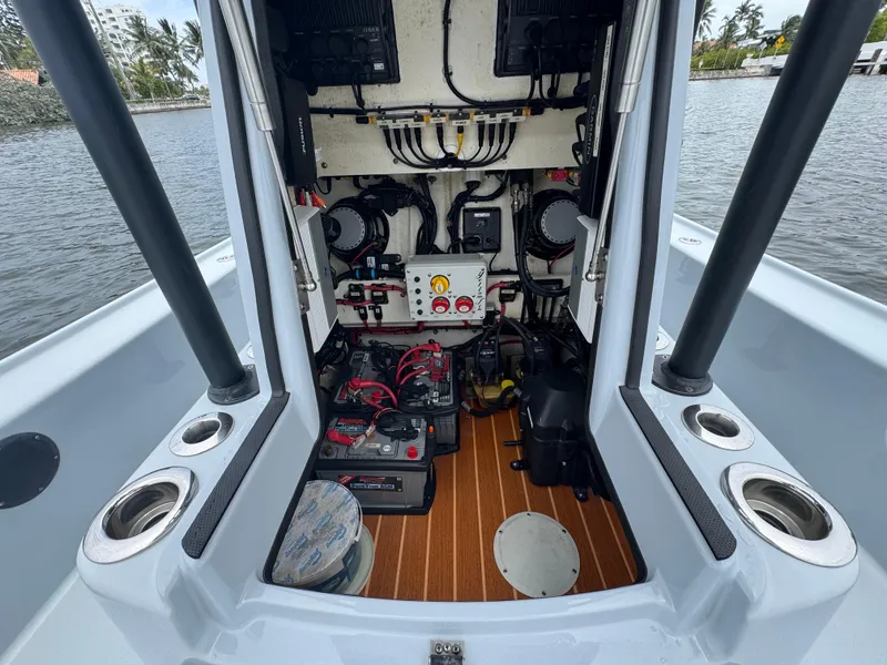 Slide: The Image of 2019 Yellowfin 24 Bay CE boat interior showing electrical components and wiring. - 35