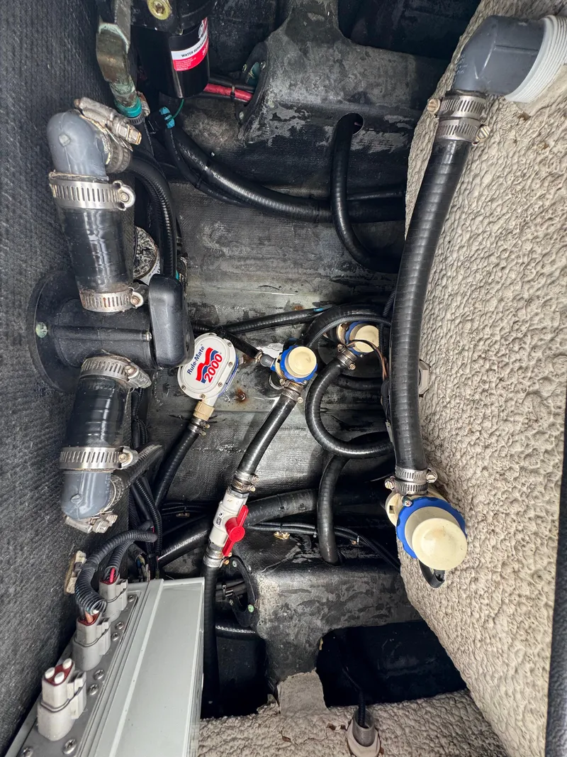 Slide: The Image of 2019 Yellowfin 24 Bay CE boat plumbing system with hoses and connectors. - 36