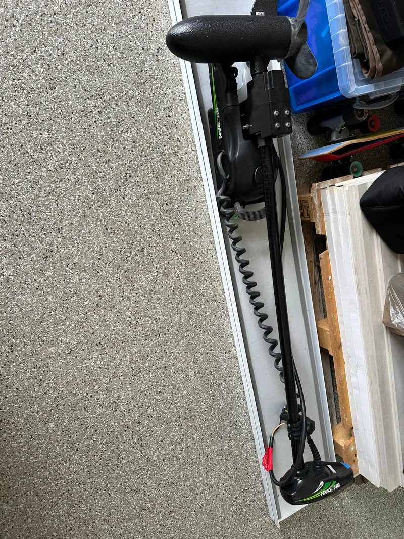 Slide: The Image of 2019 Yellowfin 24 Bay CE boat equipment stored in a garage. - 39