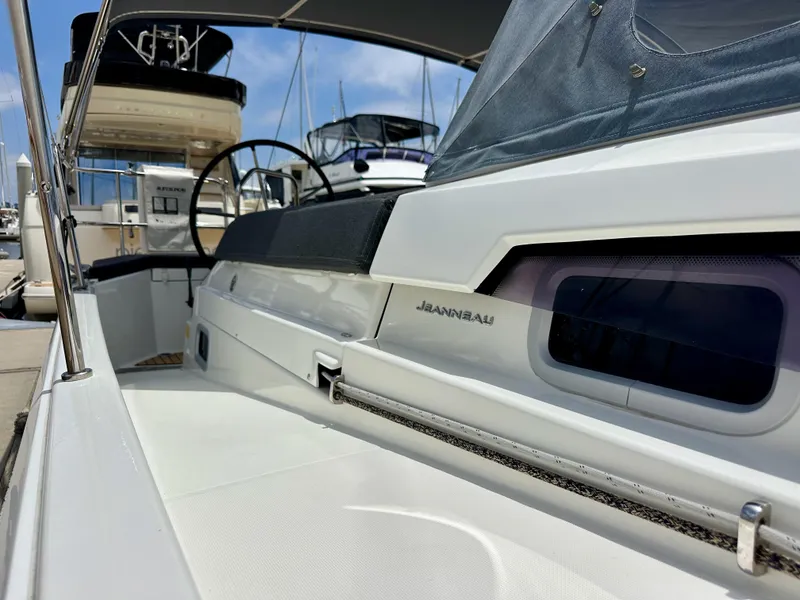 Slide: The Image of Jeanneau Sun Odyssey 440 yacht, 2021 model, docked at marina with sleek design. - 11