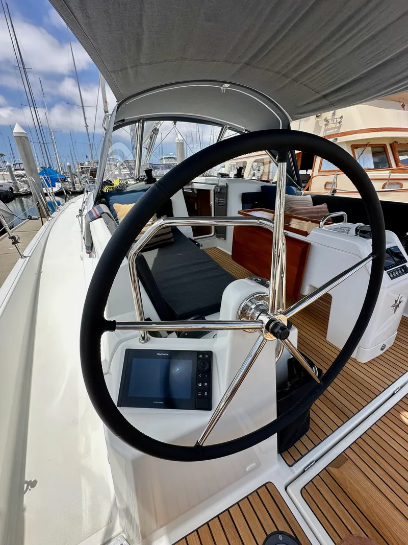 Slide: The Image of Steering wheel of 2021 Jeanneau Sun Odyssey 440 sailboat, docked at marina. - 20