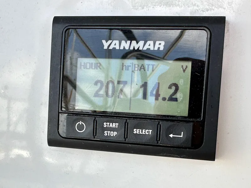 Slide: The Image of Yanmar engine display showing 207 hours and 14.2 volts on Jeanneau Sun Odyssey 440, 2021 model. - 28