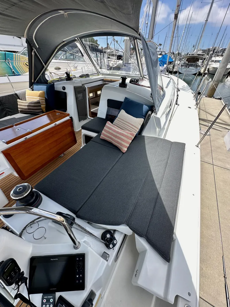 Slide: The Image of Jeanneau Sun Odyssey 440, 2021 model, featuring a spacious cockpit with comfortable seating. - 30