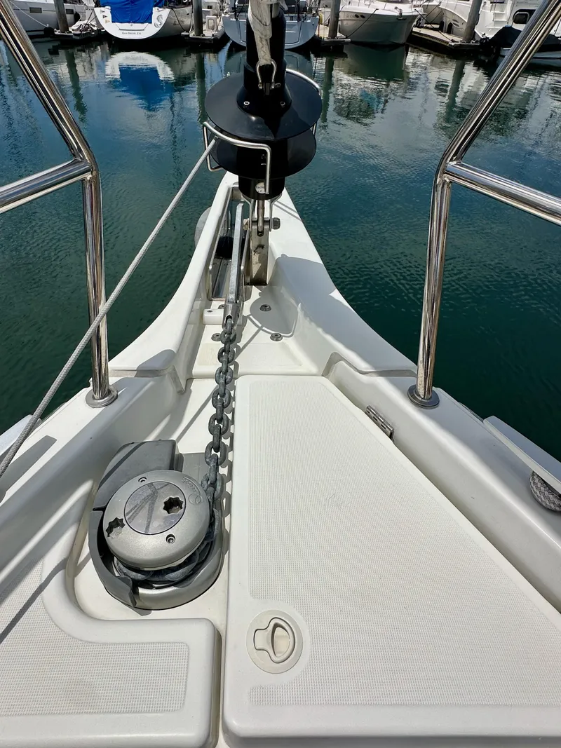 Slide: The Image of Bow of 2021 Jeanneau Sun Odyssey 440 with anchor chain and winch. - 36