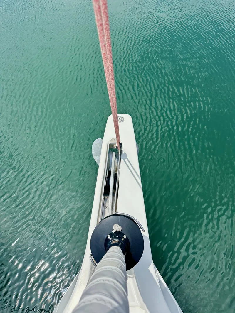 Slide: The Image of Bow view of Jeanneau Sun Odyssey 440 sailboat, 2021, on calm turquoise water. - 38