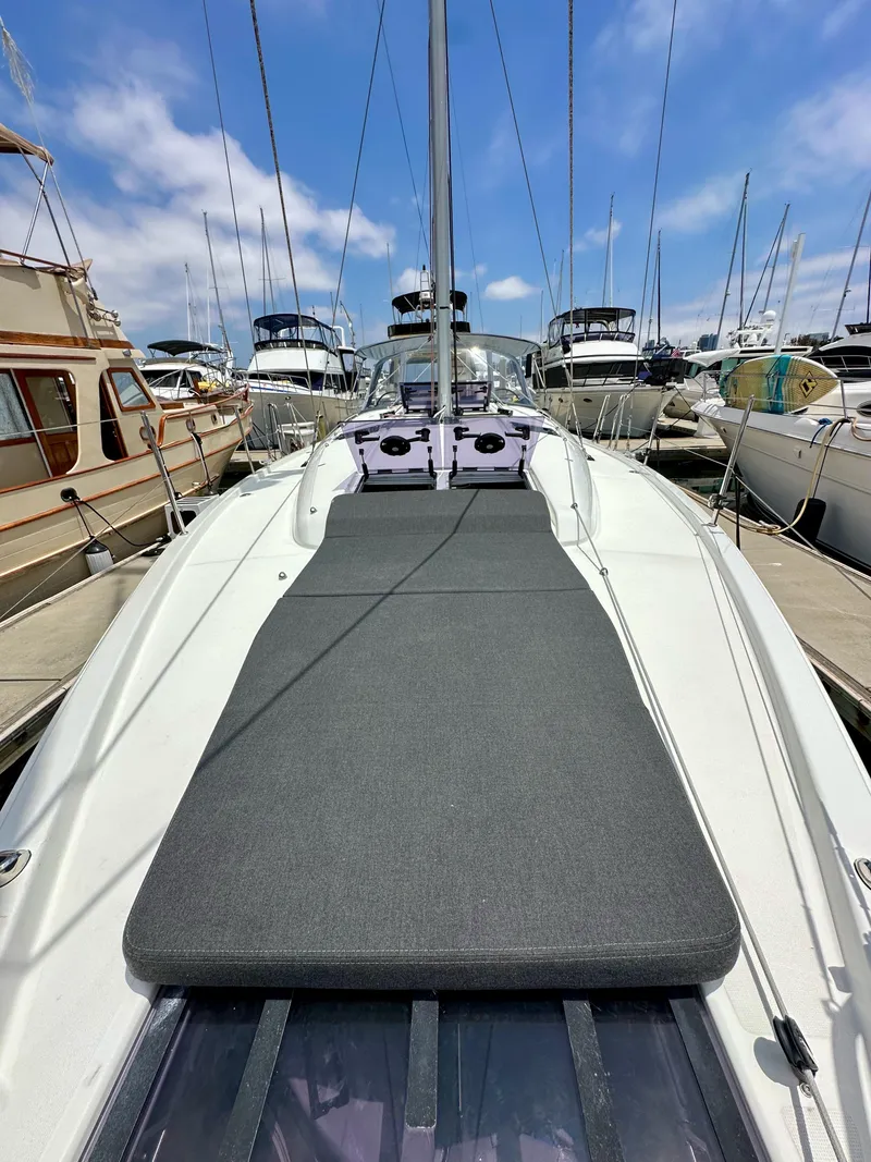 Slide: The Image of Jeanneau Sun Odyssey 440 sailboat, 2021 model, docked with sunbathing area, clear sky. - 39