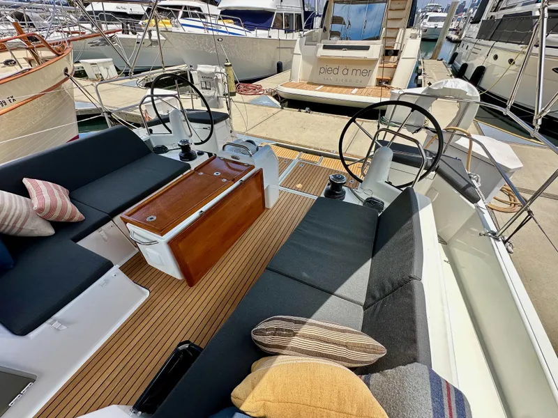 Slide: The Image of Jeanneau Sun Odyssey 440, 2021 model, featuring a spacious cockpit with dual steering wheels. - 42