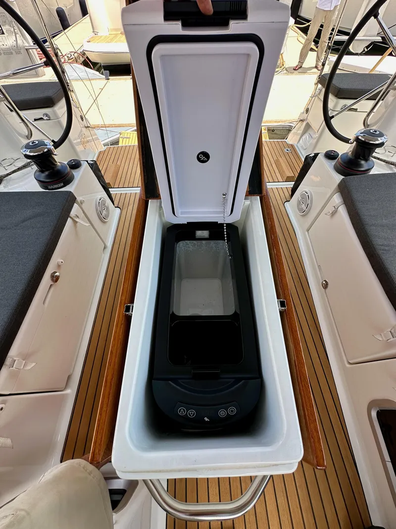 Slide: The Image of Open storage compartment on Jeanneau Sun Odyssey 440 yacht, 2021 model, with teak flooring. - 47