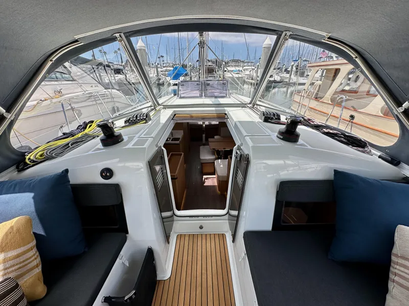 Slide: The Image of Interior view of 2021 Jeanneau Sun Odyssey 440 sailboat, showcasing cockpit and cabin entrance. - 48