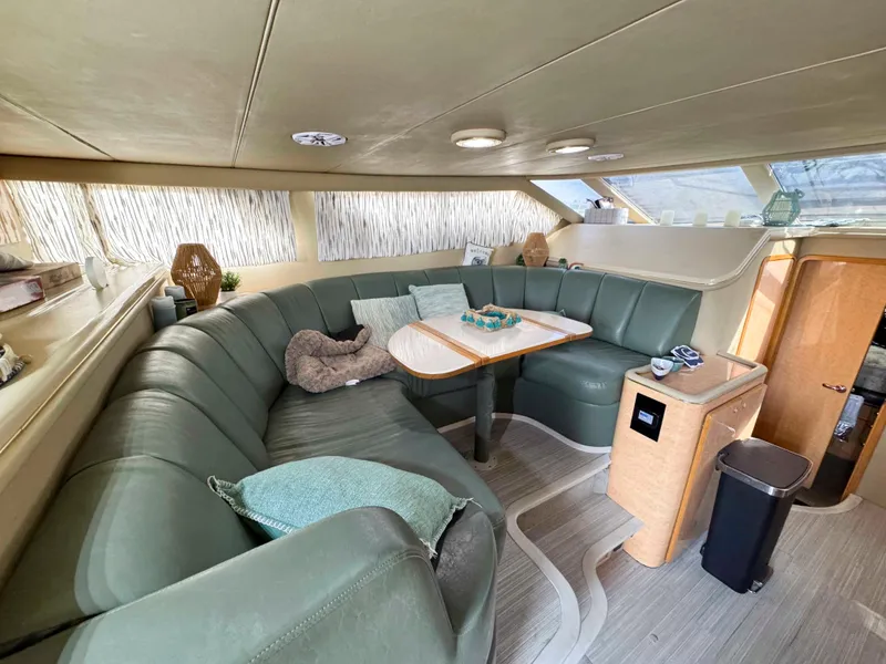 Slide: The Image of Luxurious interior of 1998 Sea Ray 440 Express Bridge yacht with plush seating and elegant decor. - 15