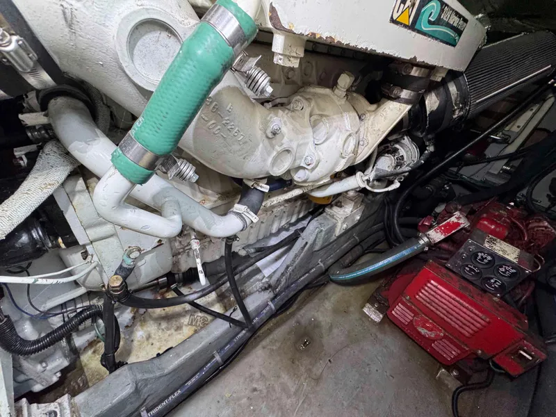 Slide: The Image of Engine compartment of a 1998 Sea Ray 440 Express Bridge boat, showing mechanical components. - 29